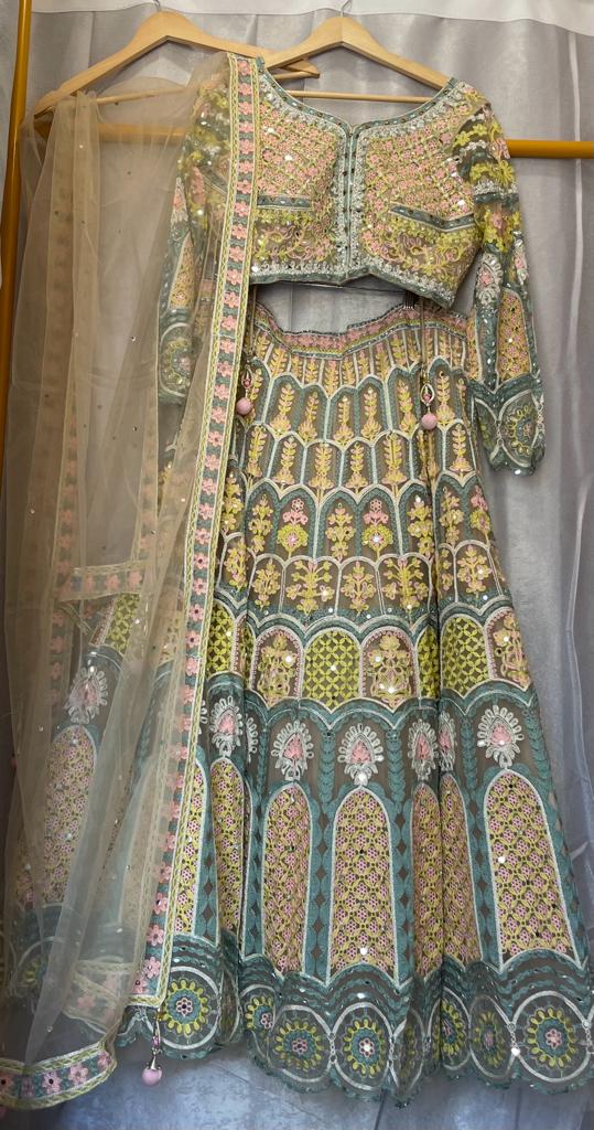 Yellow net zarkan mirror embroidery lehenga with designer choli
