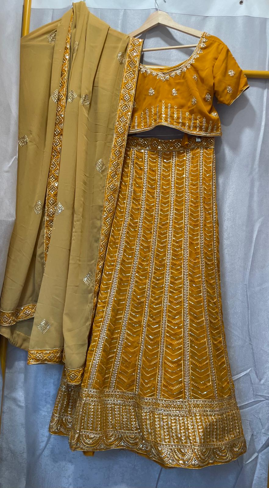 Yellow mustard Georgette lakhnavi lehenga with silver gold embroidery