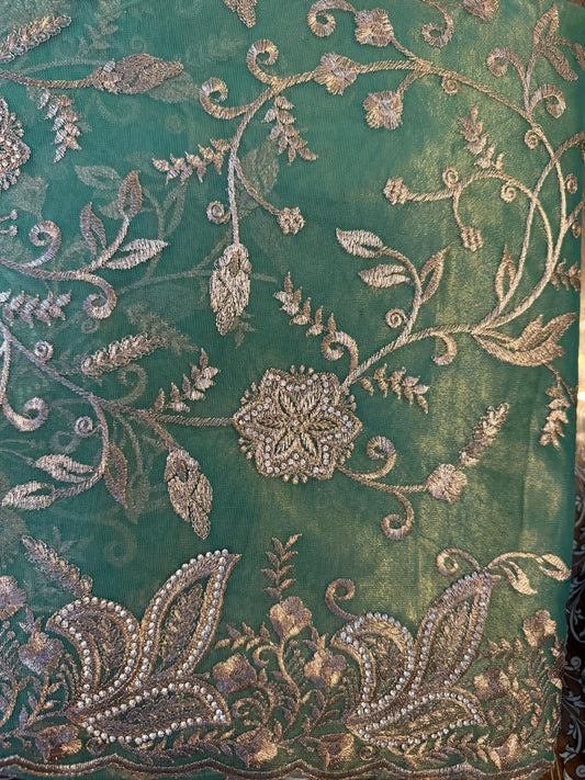 Tissue organza saree with gold zarkan embroidery with attached embroidered blouse piece and petticoat included