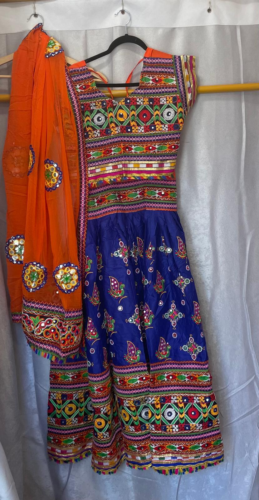 blue garba dress Midnight blue magic for the Garba nights Draped in elegance with our stunning Navratri special lehenga choli featuring: Rich midnight blue flair lehenga with grand volume Intricate mirror work