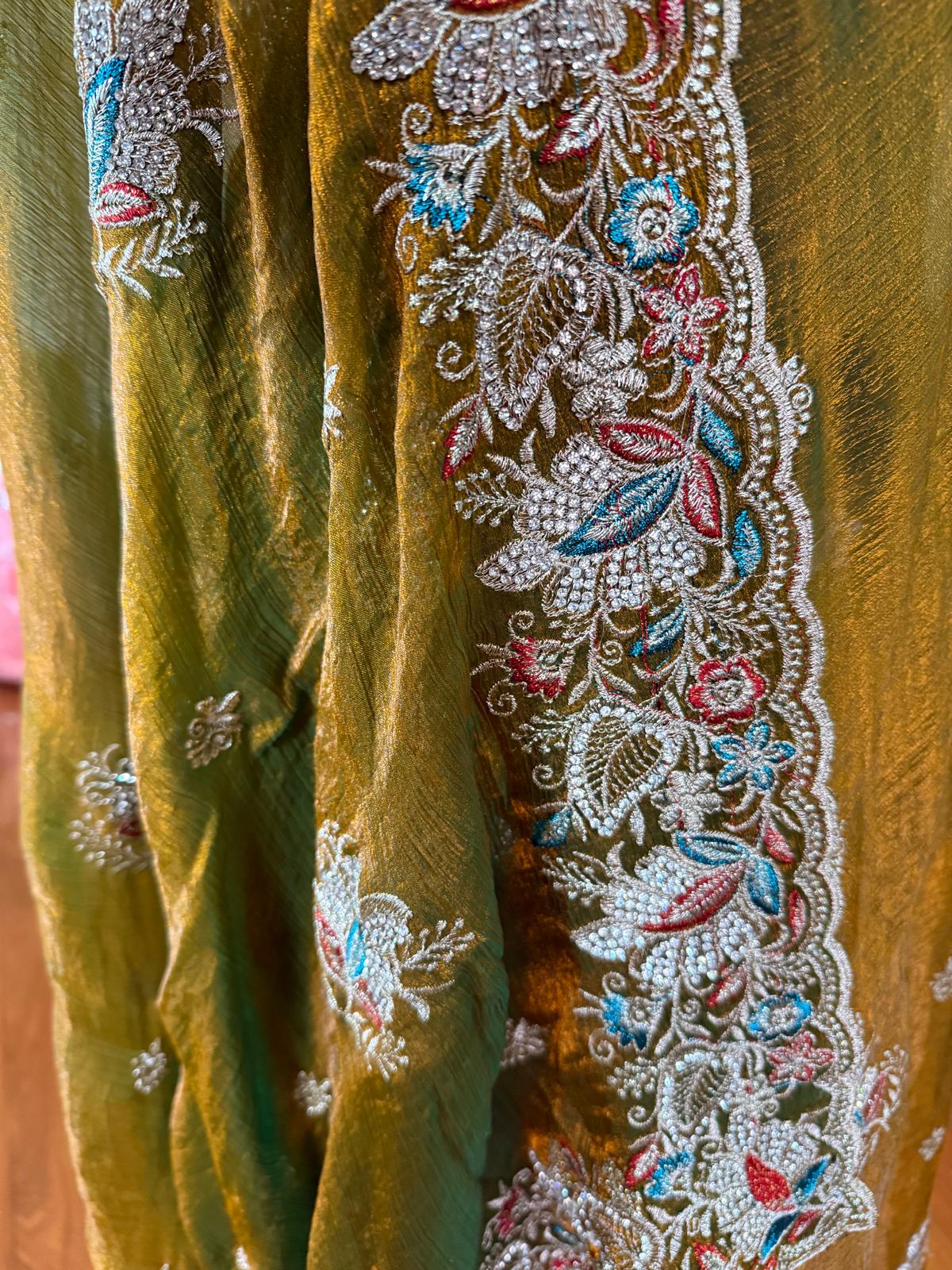 Green fendi silk saree with embroidery and stone work with attached blouse piece