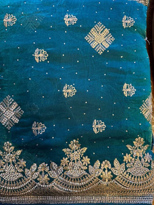 teal fendi silk saree with embroidery and heavy stone work with attached designer blouse piece