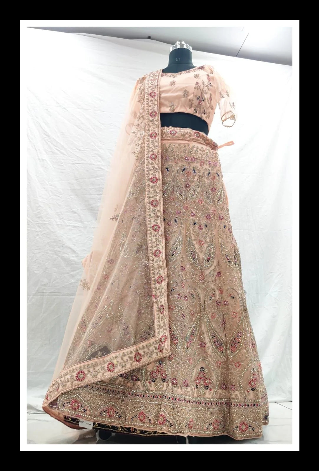 Peach embroidery zarkan net heavy designer lehenga