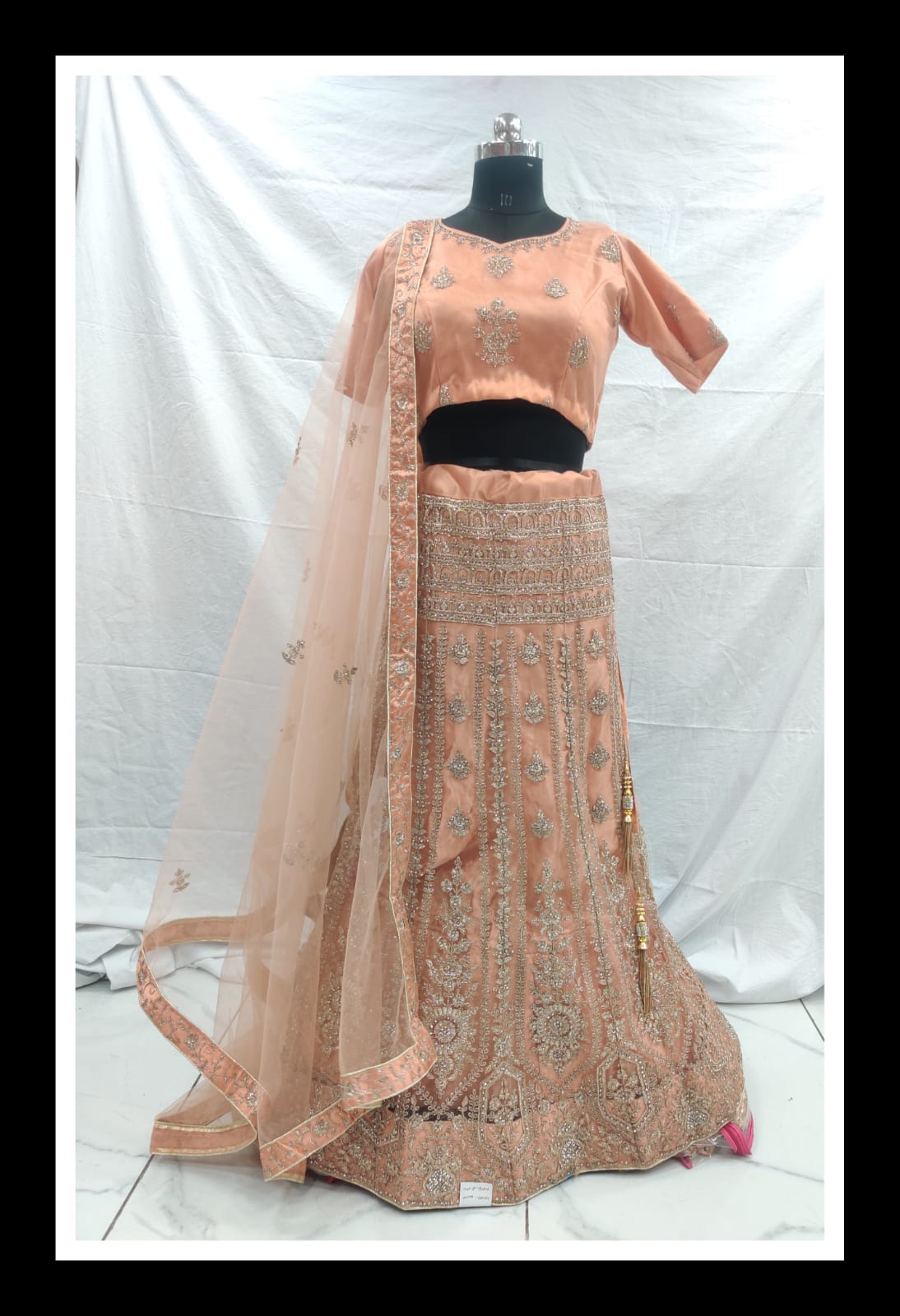 Orange peach net zarkan embroidery lehenga