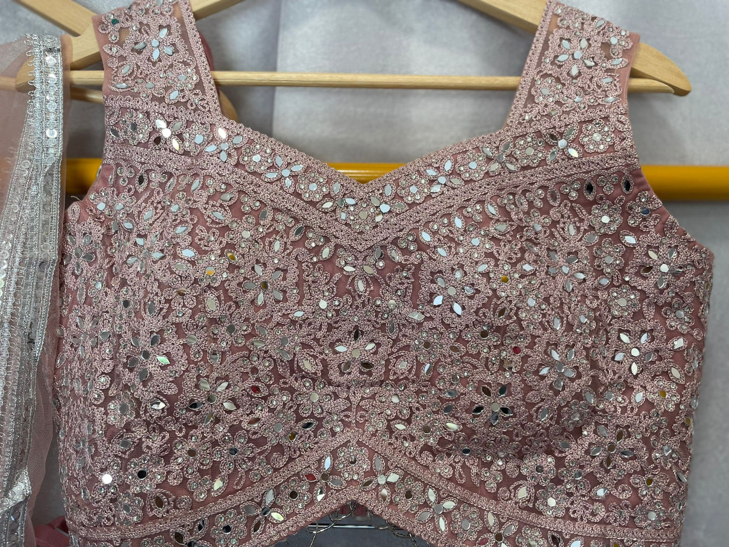 Pink net zarkan mirror lehenga with designer blouse