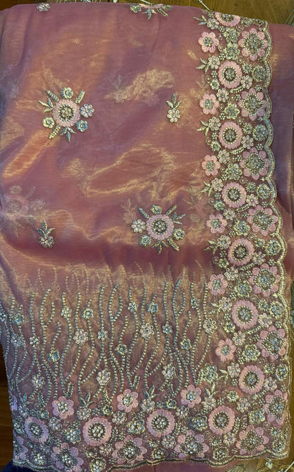 Tissue organza saree with gold zarkan contrast embroidery with attached embroidered blouse piece and petticoat included