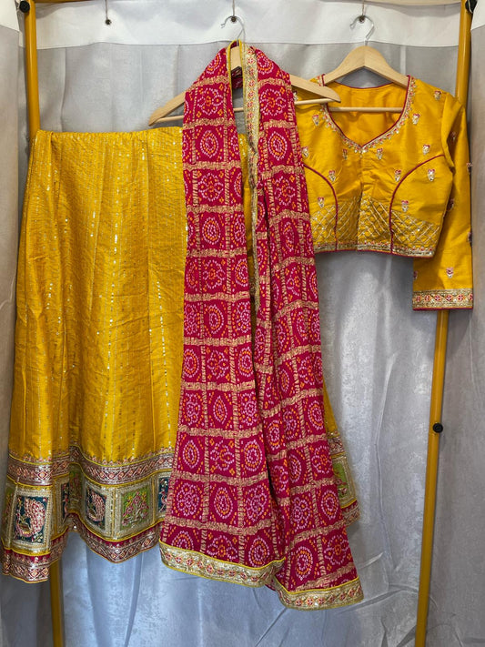 Yellow silk sequence peacock motif lehenga with pink bandani dupatta