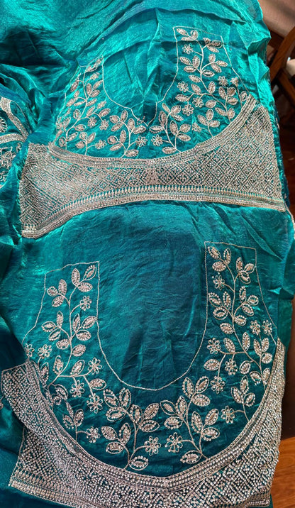 teal blue  fendi silk saree with embroidery and heavy stone work with attached designer blouse piece
