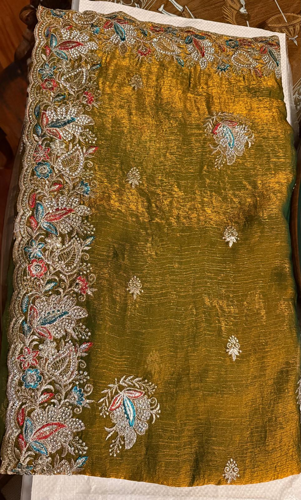 green fendi saree with embroidery and stone work with attached blouse piece