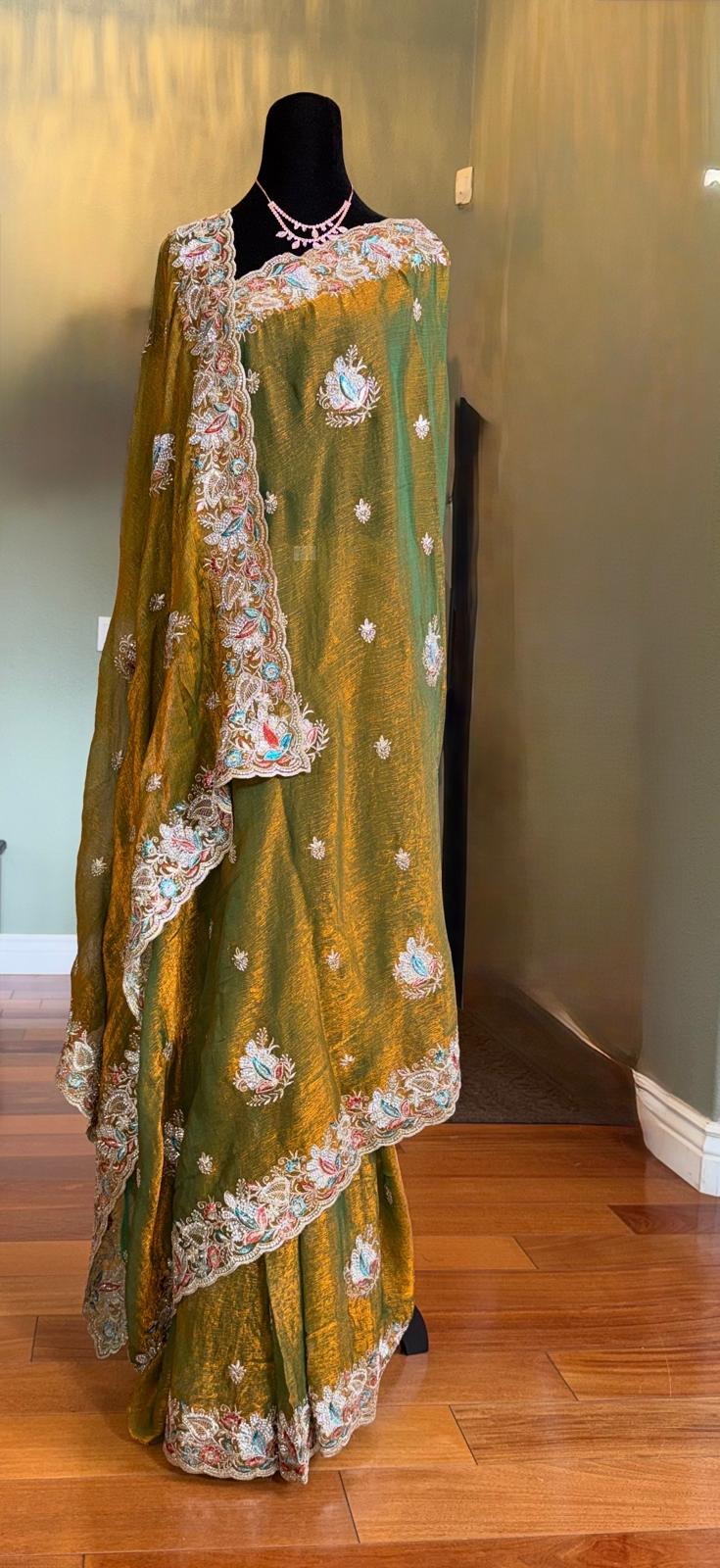 Green fendi silk saree with embroidery and stone work with attached blouse piece