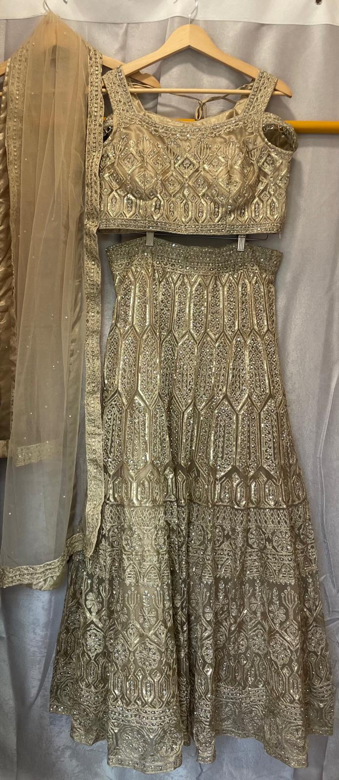 Gold net zarkan sequence embroidery with designer cold shoulder choli