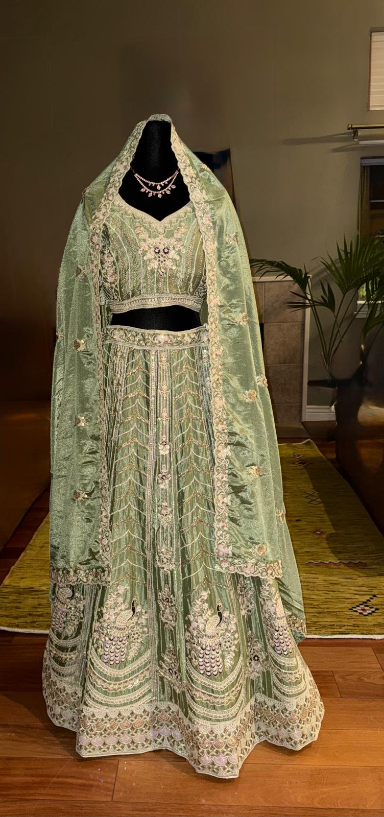 Mint sequence gold embroidery lehenga with peacock design