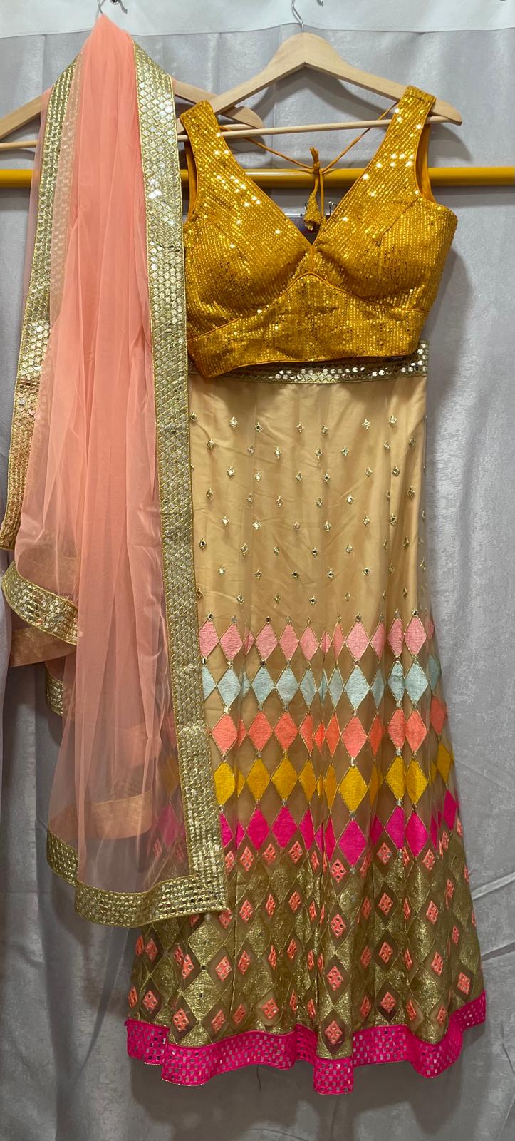 Yellow peach pink sequence multi work lehenga with peach net dupatta