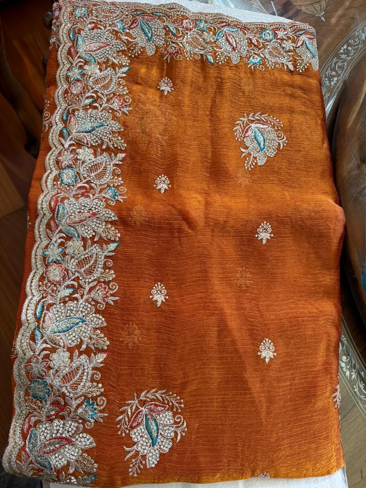 orange fendi saree with embroidery and stone work with attached blouse piece