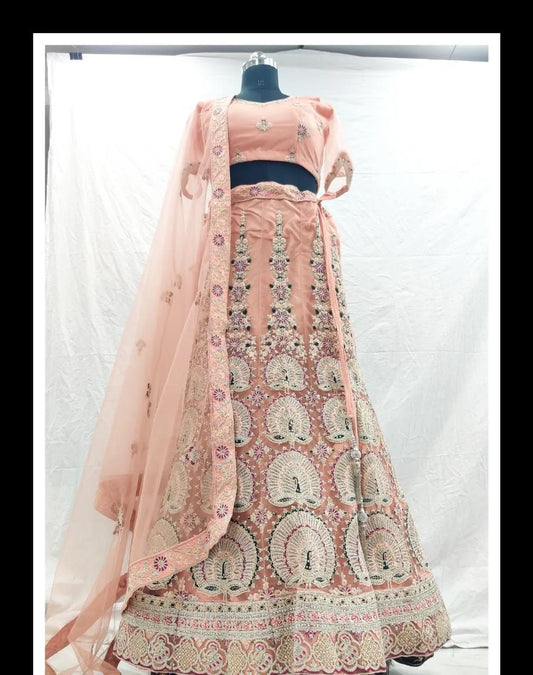 Peach peacock designer net zarkan embroidery lehenga