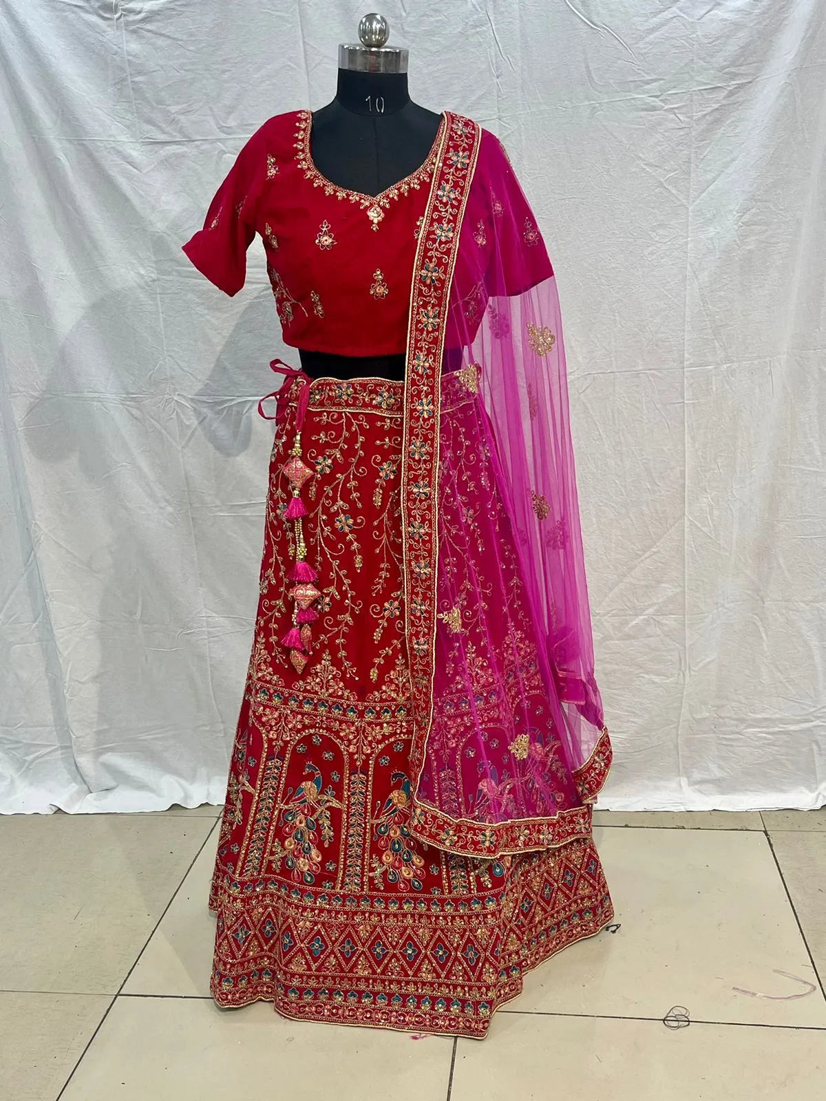 Rani pink velvet embriodery zarkan heavy lehenga