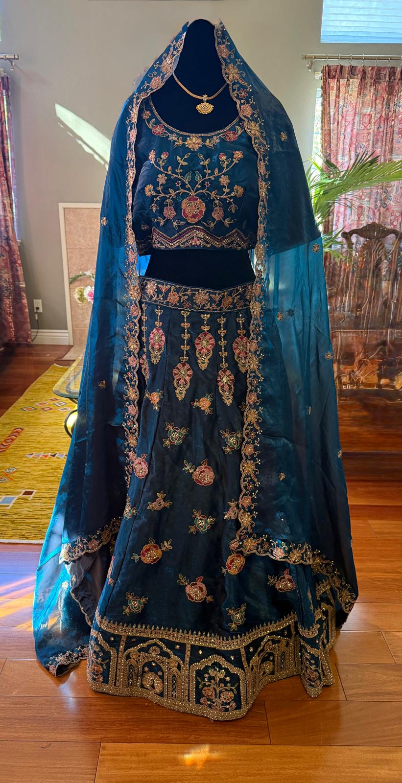 Teal blue fendi silk embroidery stone work lehenga with peacock motiffs designer blouse
