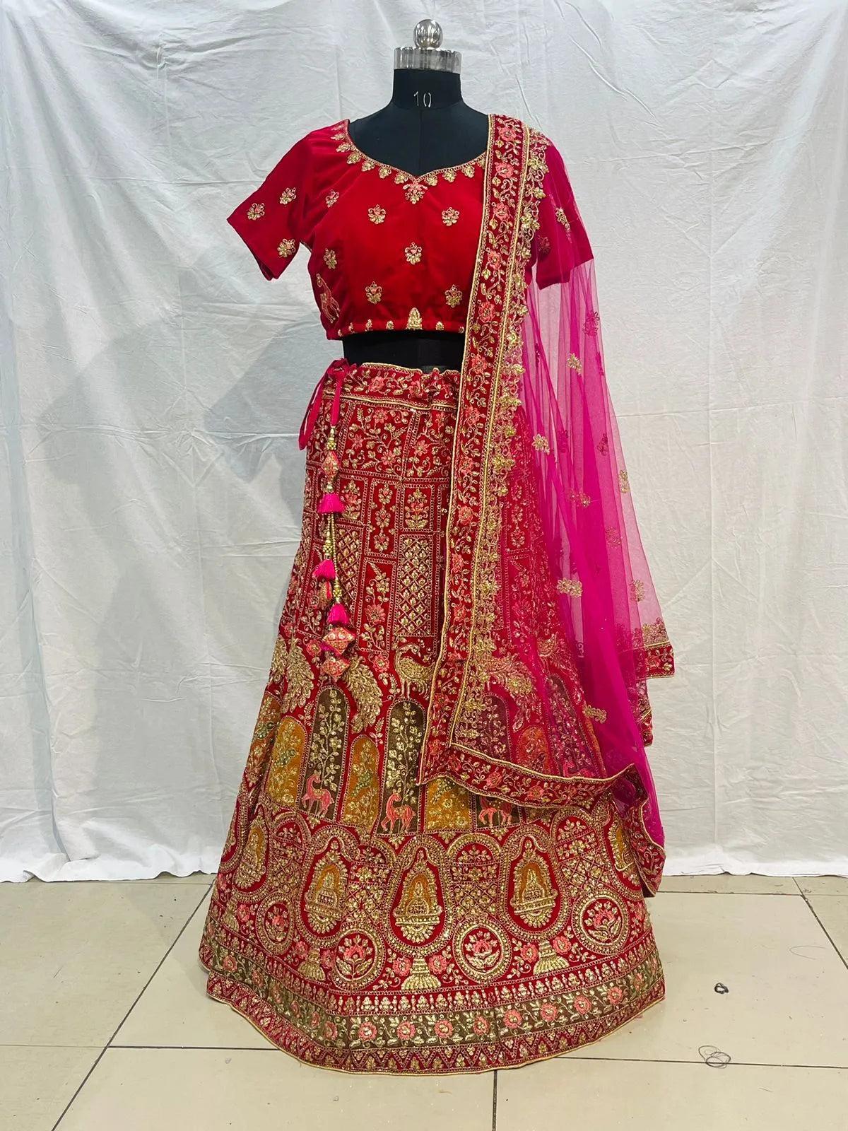 Rani pink velvet embriodery zarkan heavy lehenga