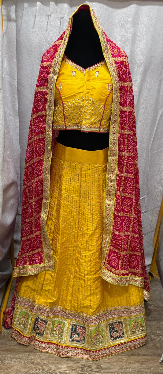 Yellow silk sequence peacock motif lehenga with pink bandani dupatta